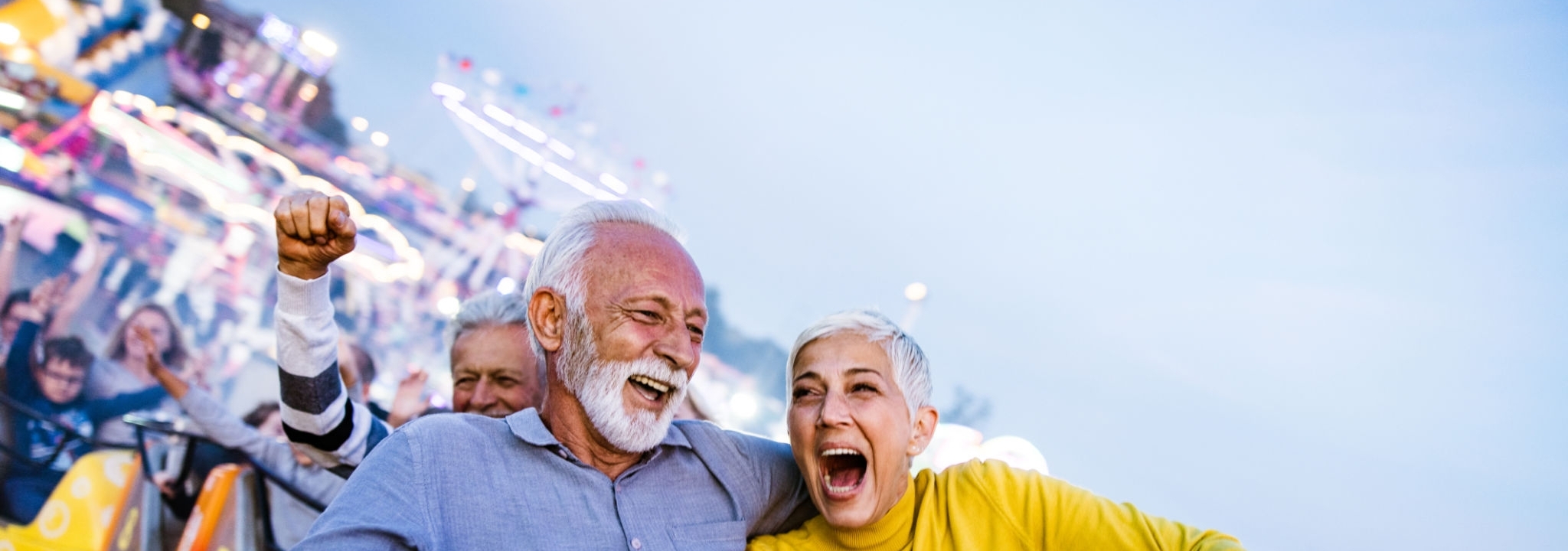 An old couple is cheering up for the experience they have received in theme park.